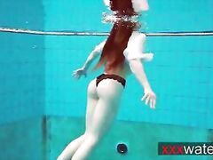Pierced teen swimming